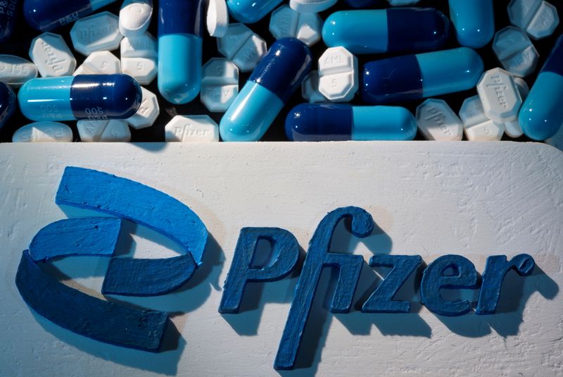 FILE PHOTO: A 3D printed Pfizer logo is placed near