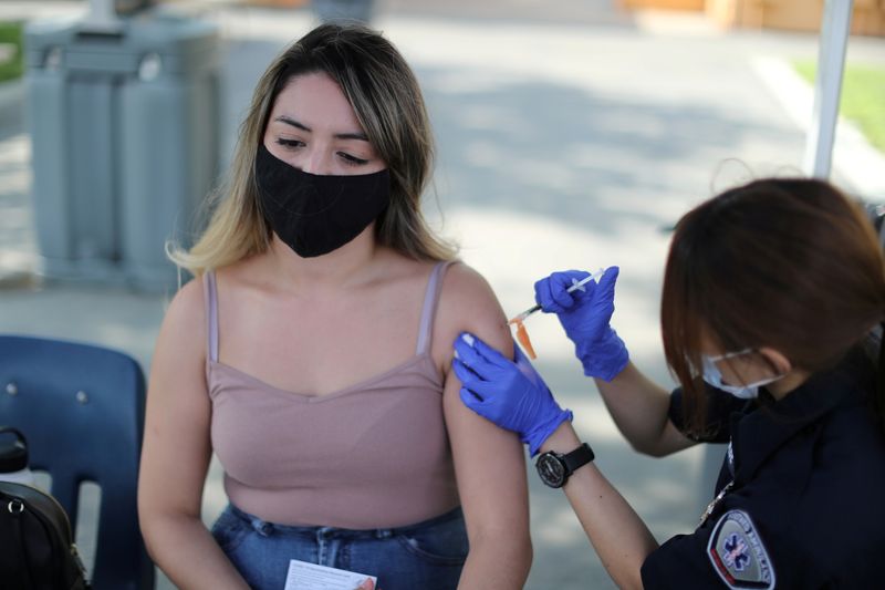 FILE PHOTO: Julissa Vasquez, 23, receives a coronavirus disease (COVID-19)