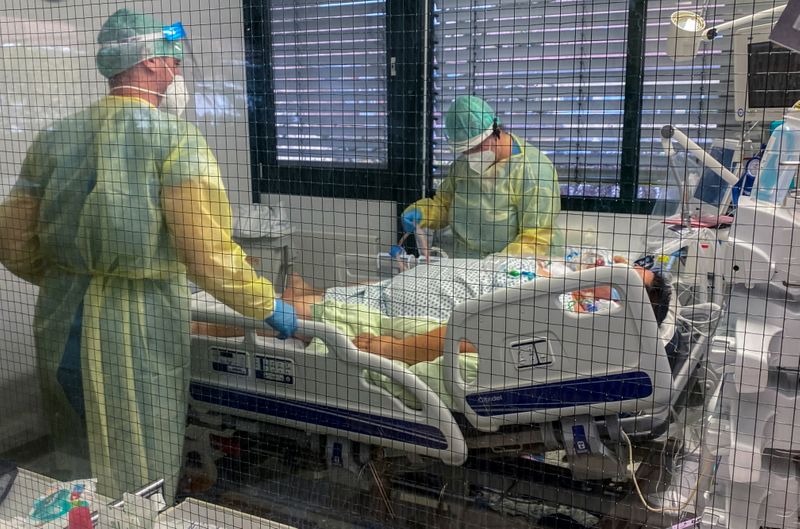 Medical staff members of Munchen Klinik Schwabing hospital take care