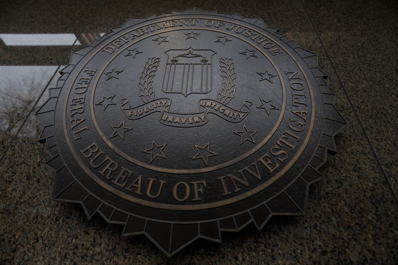 The Federal Bureau of Investigation seal and motto are seen