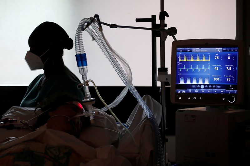 FILE PHOTO: A COVID-19 patient connected to a ventilator tube