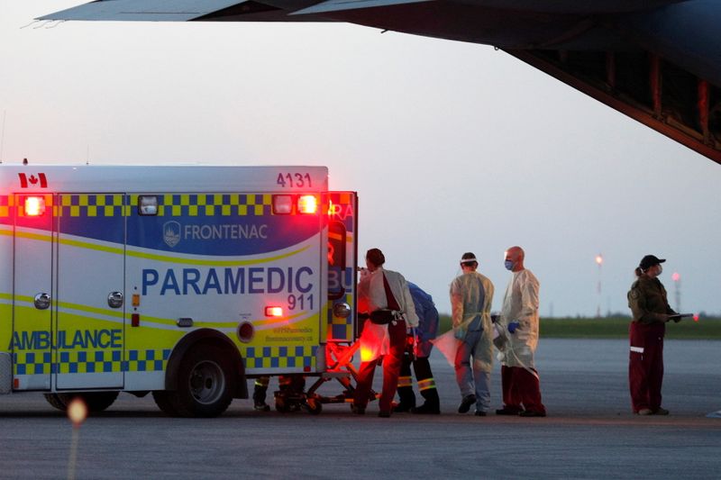 FILE PHOTO: Medical personnel unload a patient from a Royal