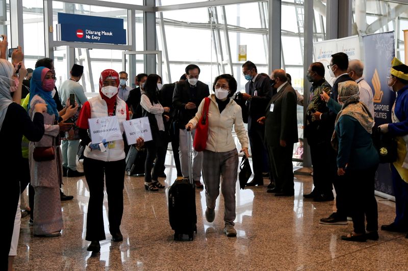 Travellers arrive at Kuala Lumpur International Airport in Sepang, Malaysia