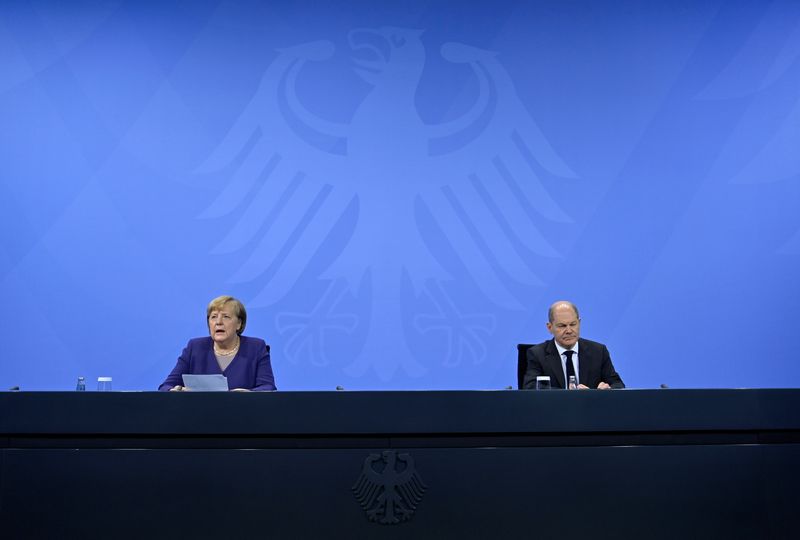 German Chancellor Angela Merkel and her designated successor Olaf Scholz