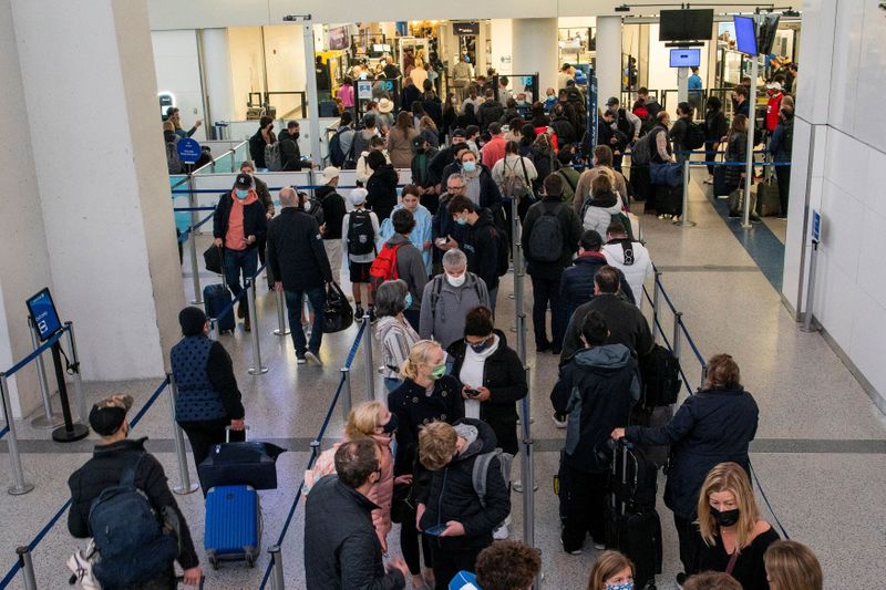 FILE PHOTO: Passengers travelling at Newark Liberty International Airport in