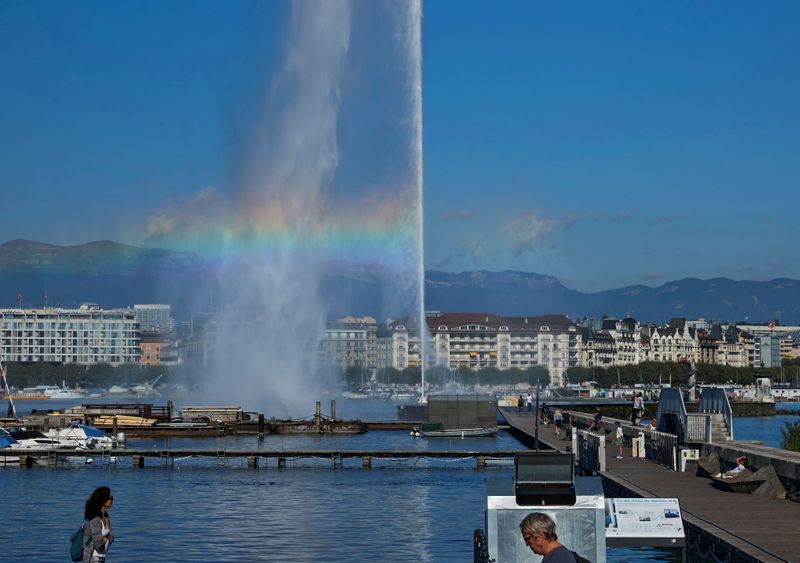 FILE PHOTO: A rainbow is pictured in the Jet d’Eau