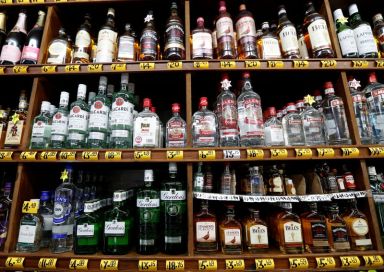 Bottles of alcoholic beverages are seen for sale in a