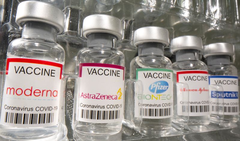 FILE PHOTO: Vials labelled “Moderna, AstraZeneca, Pfizer – Biontech, Johnson&Johnson,