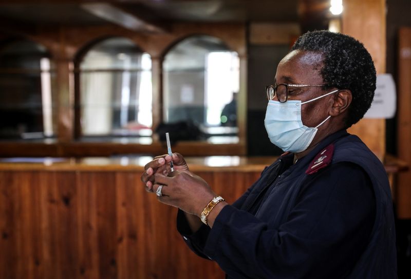 A healthcare worker prepares a dose of the Pfizer coronavirus