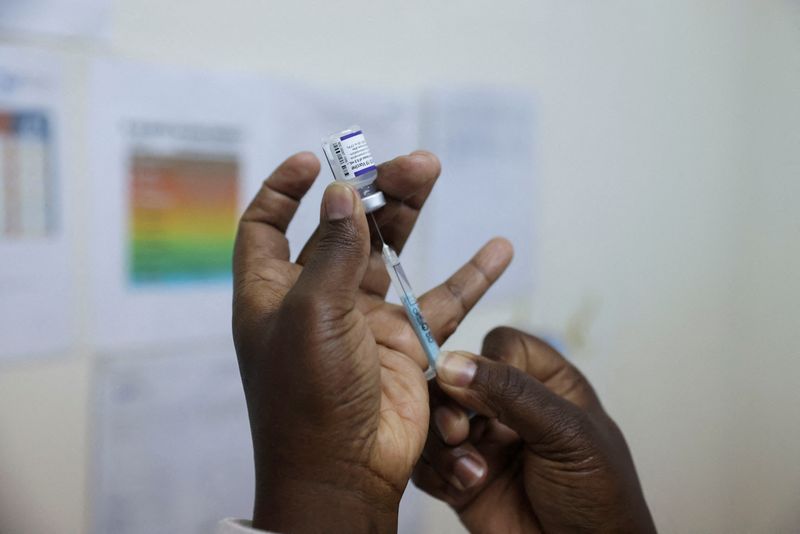 FILE PHOTO: A health worker prepares a dose of Pfizer/BioNTech’s