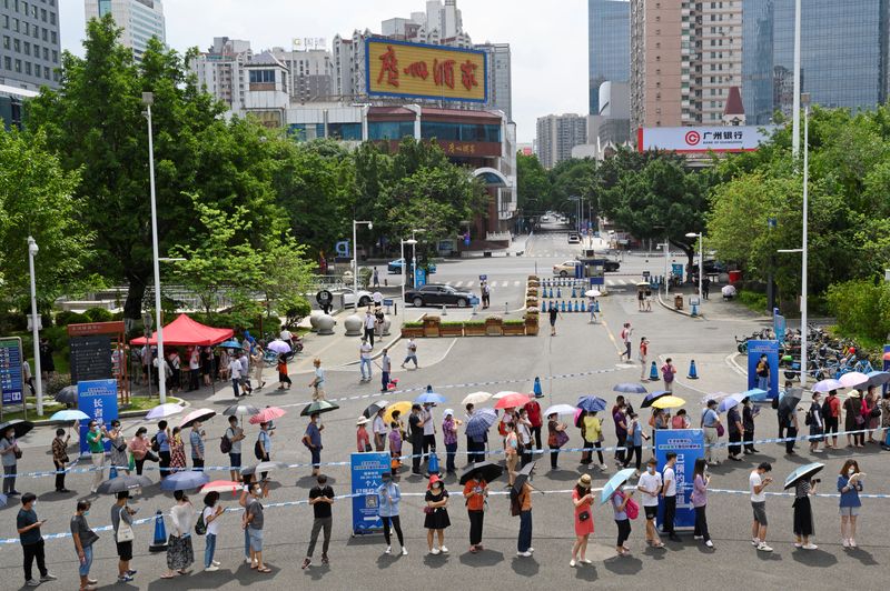 People line up to receive the COVID-19 vaccine in Guangzhou