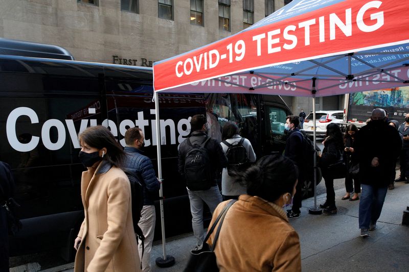People wait in line to take coronavirus disease (COVID-19) tests