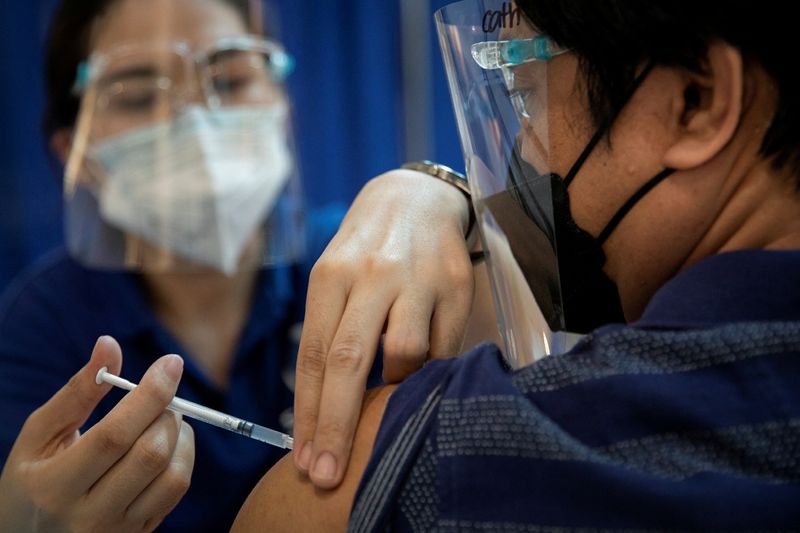 FILE PHOTO: Healthcare workers in the Philippines take booster shots