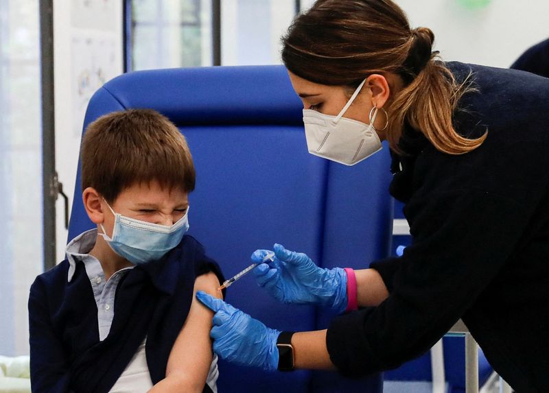 Children receive their first dose of coronavirus disease (COVID-19) vaccine,