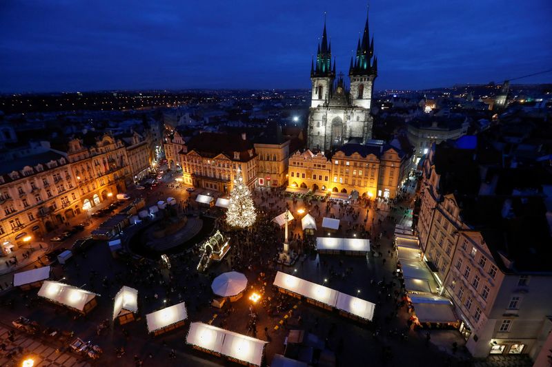 A Christmas tree is illuminated in Prague