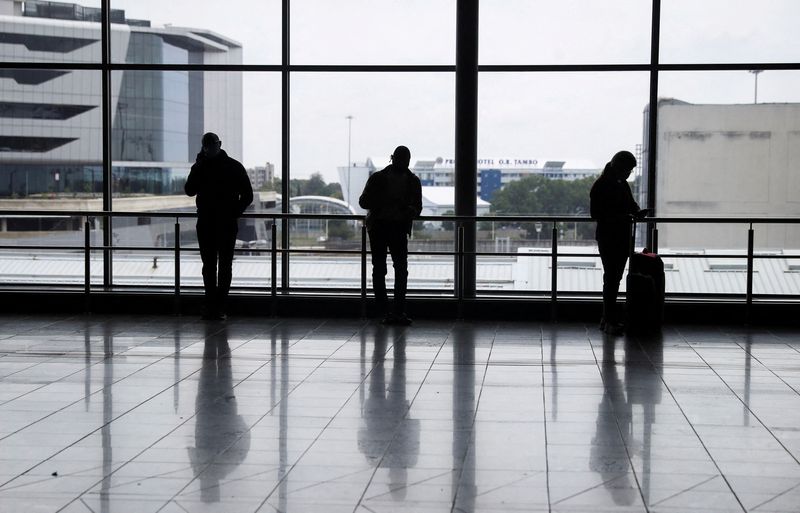 FILE PHOTO: Passengers wait to board international flights, amidst the