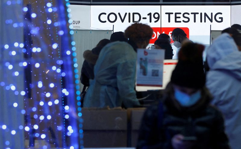 Customers are seen inside a private COVID-19 testing clinic in