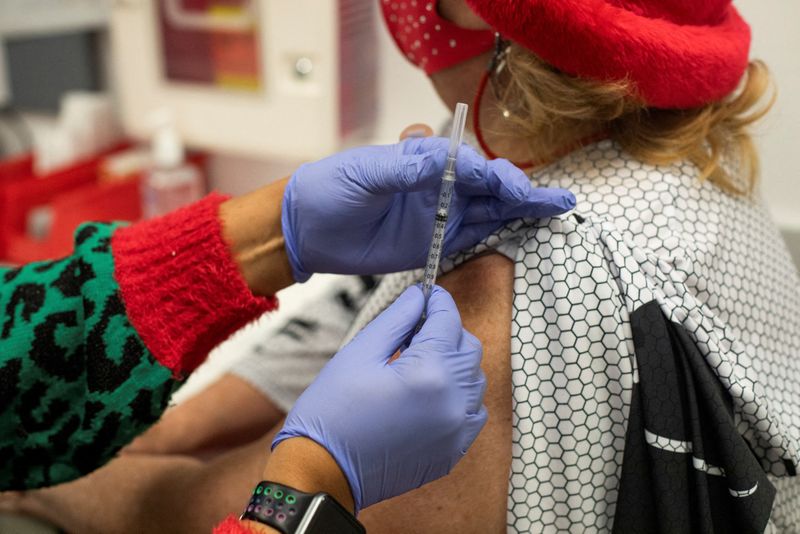 People receive COVID-19 vaccine boosters in Michigan