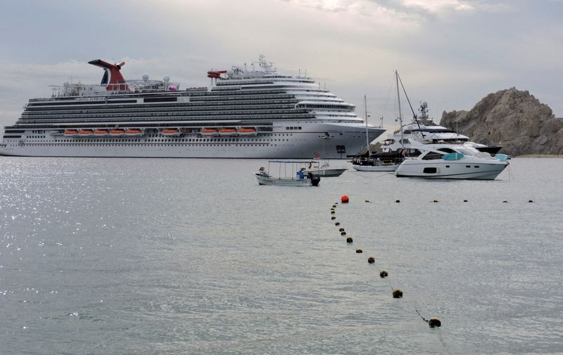 FILE PHOTO: Carnival Panorama passengers test for COVID-19 in Cabo