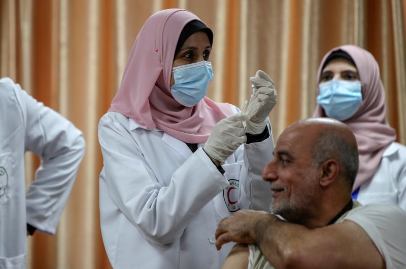 FILE PHOTO: Palestinians begin vaccination in Gaza