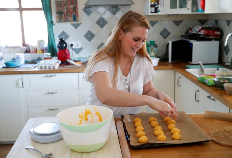 Eszter Harmath prepares pastries at her home during COVID-19 pandemic,