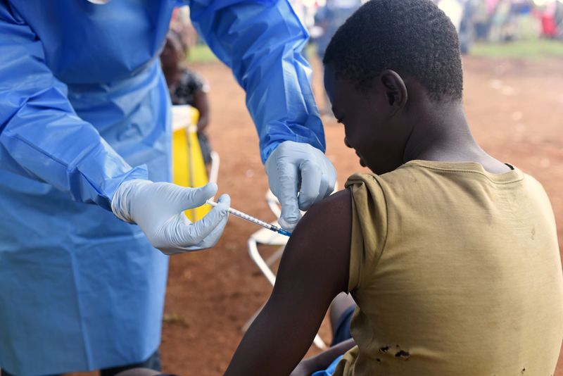 FILE PHOTO: A Congolese health worker administers Ebola vaccine to