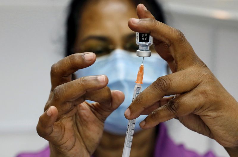 FILE PHOTO: A medical worker prepares a syringe at a