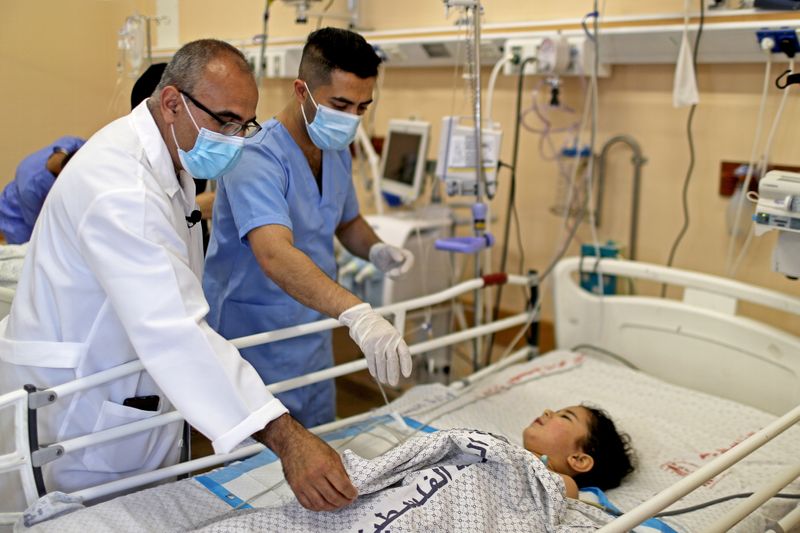 Gaza health system fight on two fronts, Covid-19 and war