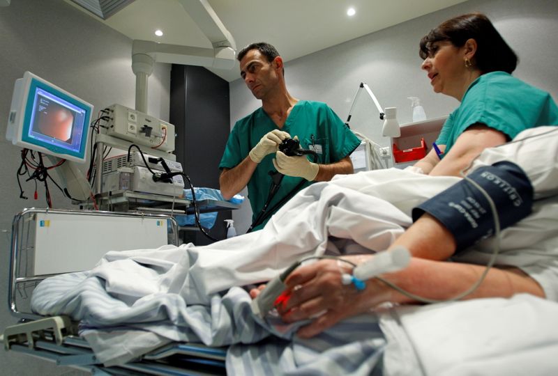 FILE PHOTO: A French doctor performs a colonoscopy on a