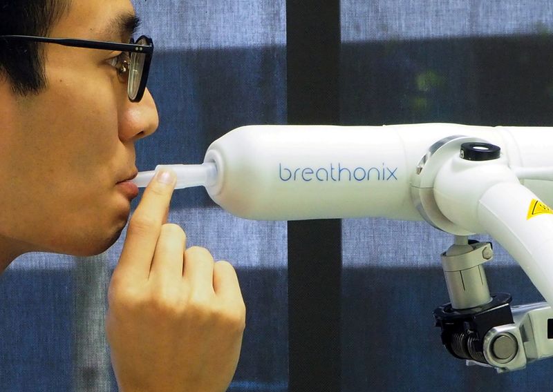 FILE PHOTO: A staff member demonstrates the usage of Breathonix