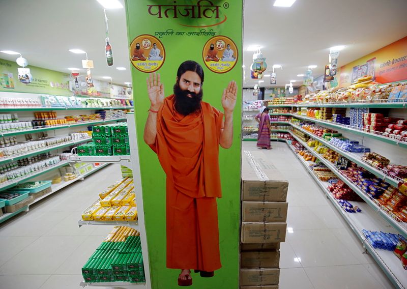 FILE PHOTO: A hoarding with an image of Baba Ramdev