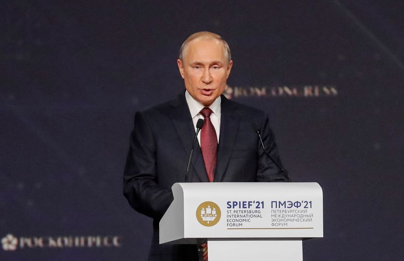 Russian President Putin delivers a speech during a session of