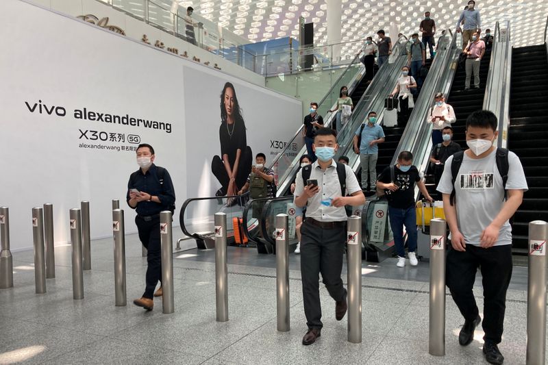 Travellers are seen at the Shenzhen Baoan International Airport in