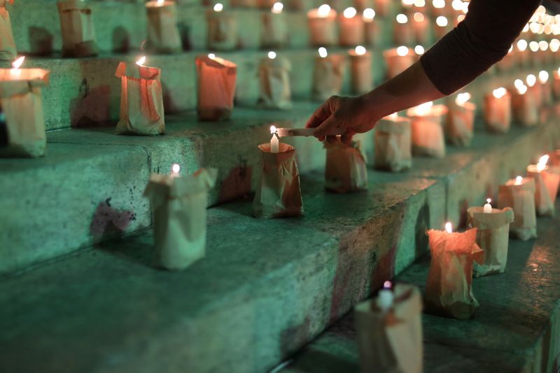 Brazilians light candles to mark 500,000 COVID-19 deaths, in Rio