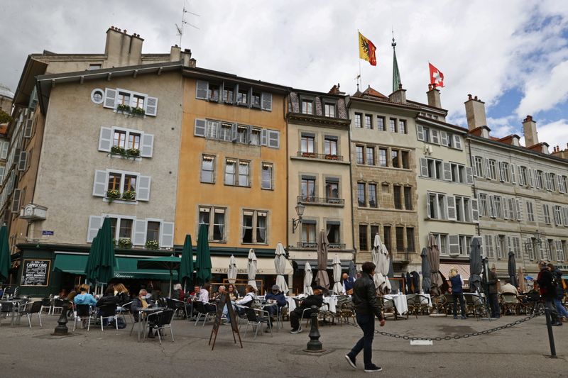 People eat on a terrace in Geneva