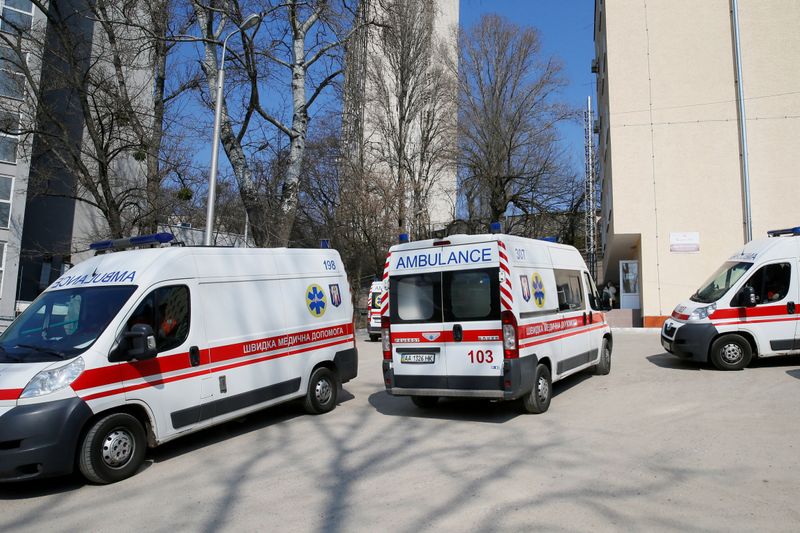 FILE PHOTO: Ambulances with COVID-19 patients wait in the queue