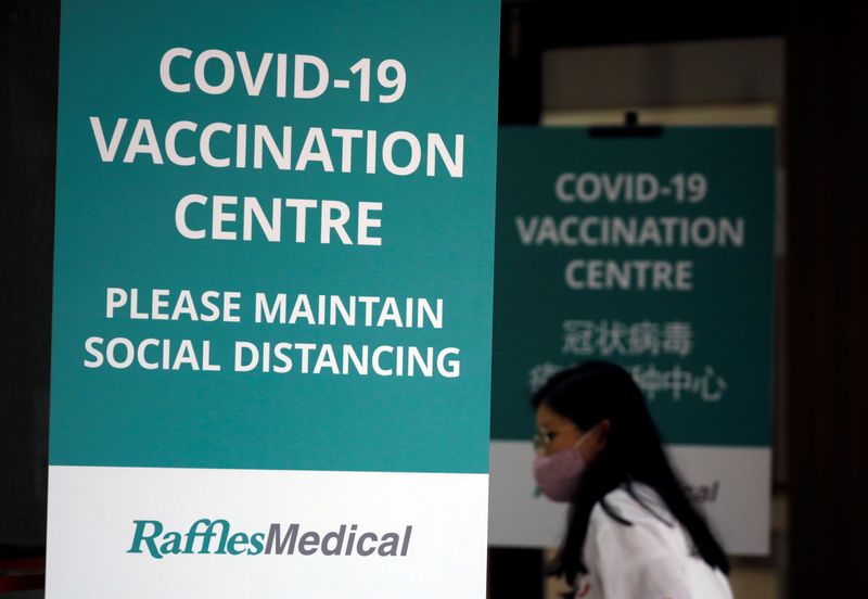 A woman walks into a newly set up vaccination center