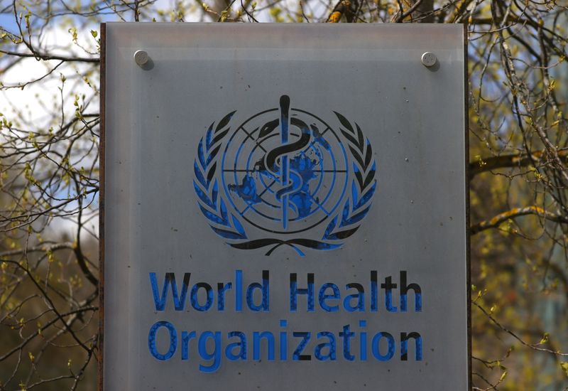 A logo is pictured outside a building of the WHO