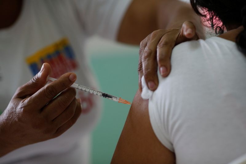 A nurse administer a dose of Cuba’s Abdala vaccine at