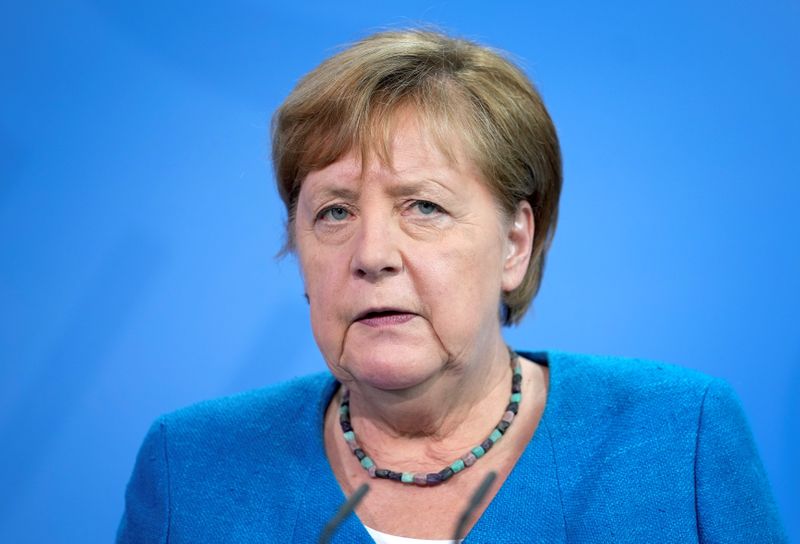 German Chancellor Angela Merkel addresses the media after a virtual
