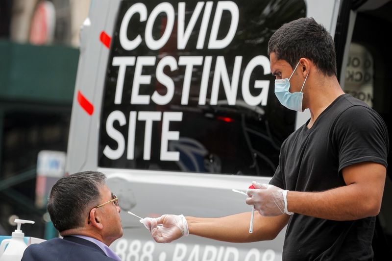 A man receives a coronavirus disease (COVID-19) test at a