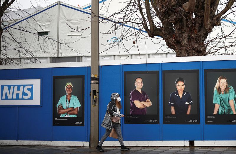 Images of National Health Service (NHS) workers displayed on hoardings