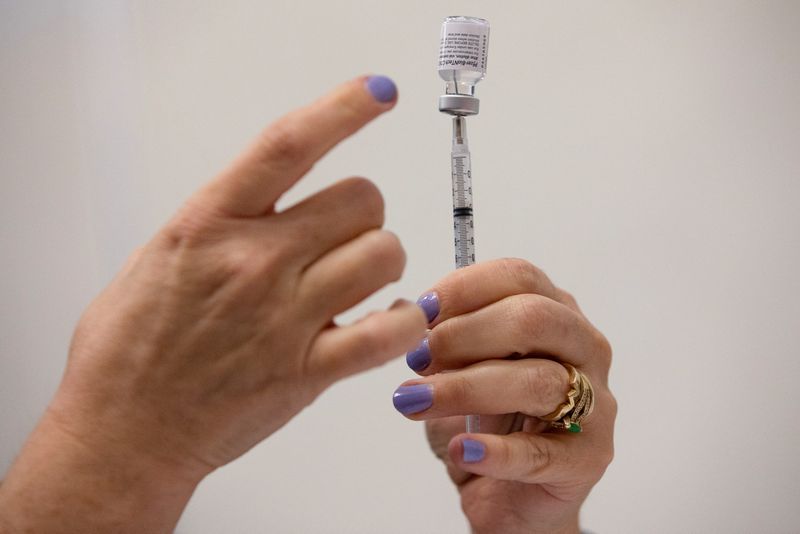 People receive COVID-19 booster vaccination in Michigan
