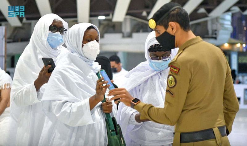Saudi police checks pilgrims for vaccination details, amid easing of