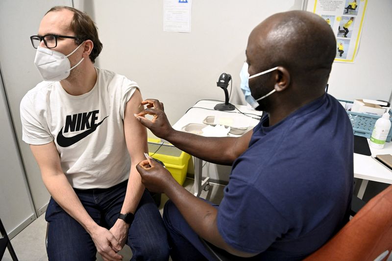 Man receives a booster dose of the coronavirus disease (COVID-19)