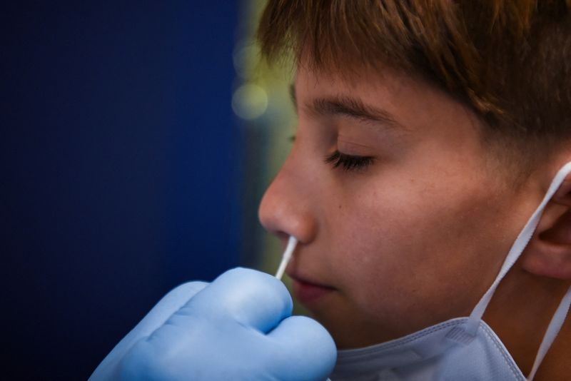 FILE PHOTO: Atlas Smookler receives a coronavirus disease (COVID-19) test