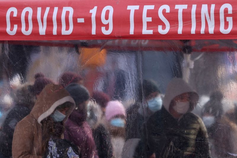 People queue to be tested for COVID-19 in Times Square