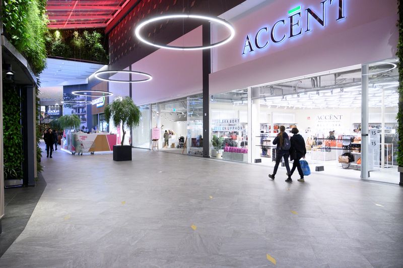 FILE PHOTO: People walk at the Granbystaden shopping center in