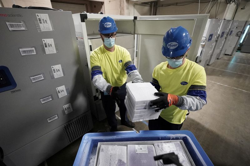 FILE PHOTO: Boxes containing the Pfizer-BioNTech COVID-19 vaccine are prepared
