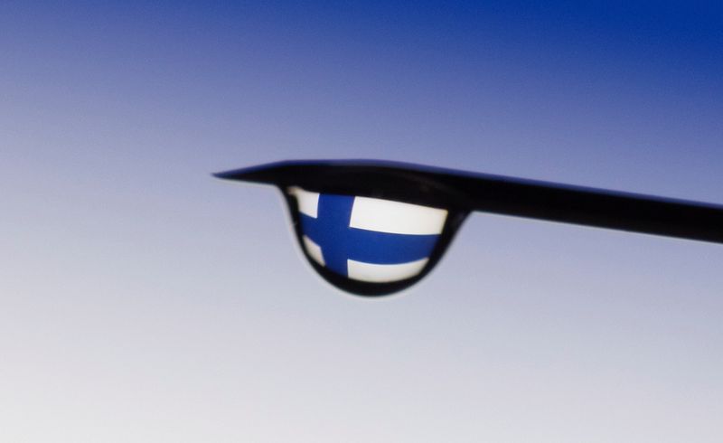 Illustration shows the flag of Finland reflected in a drop